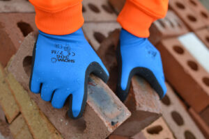 A Halton Construction builder working with the Showa 306 glove